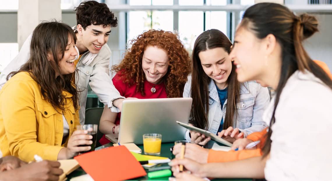 International students learning digital and AI skills in a modern classroom